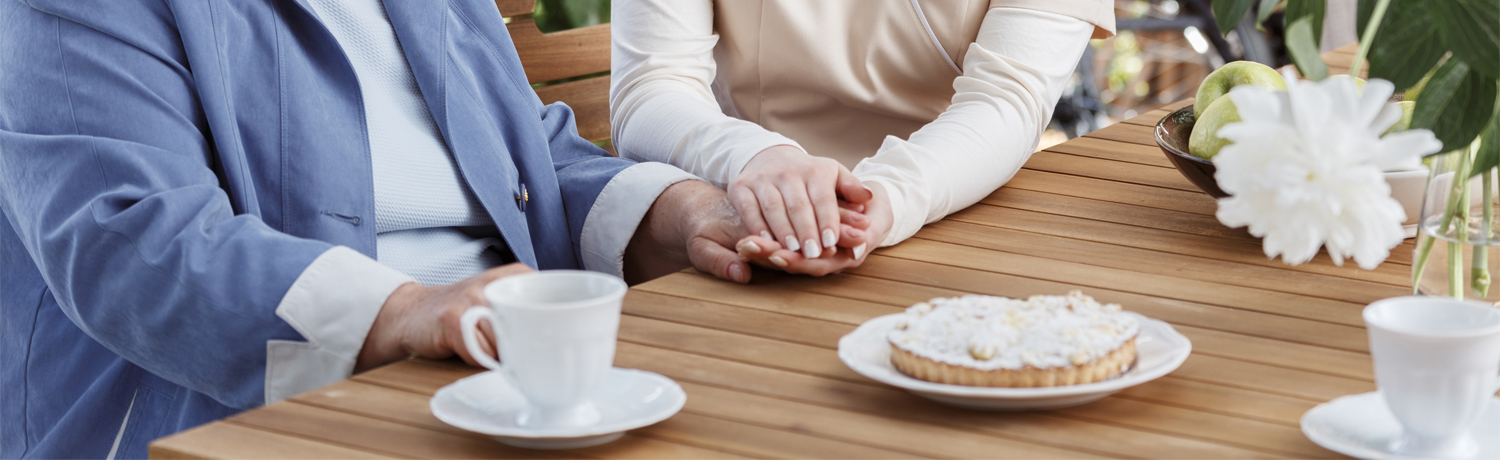 Nurse holding senior woman's hand Nurse holding senior woman's hand