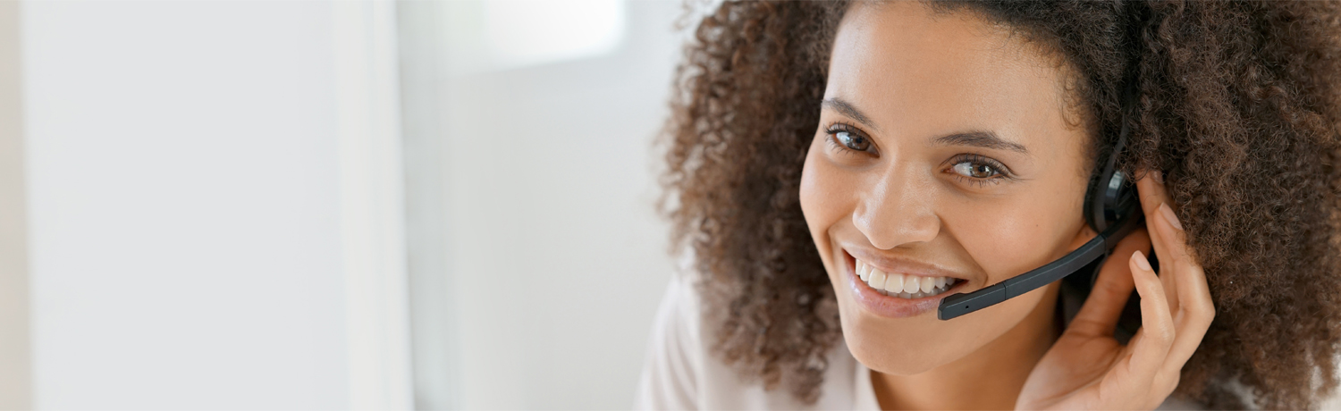 Portrait of customer service assistant talking on phone