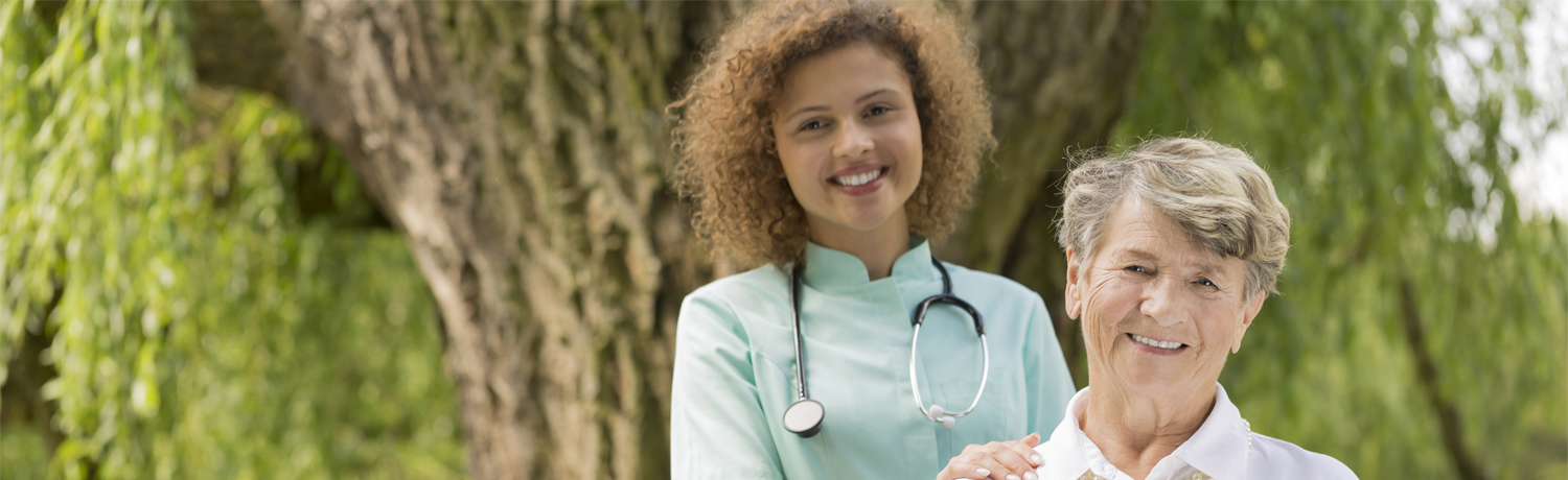 Home nurse being her best friend Optimistic portrait of a senior lady and her caregiver in the park
